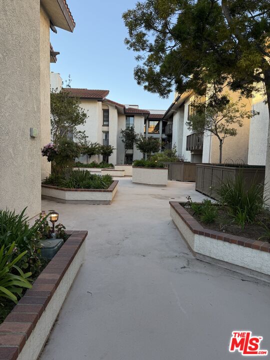 8601 Falmouth Avenue, Unit 224 Playa del Rey, CA 90293 - Photo 39 of 41 a front view of a house with a yard