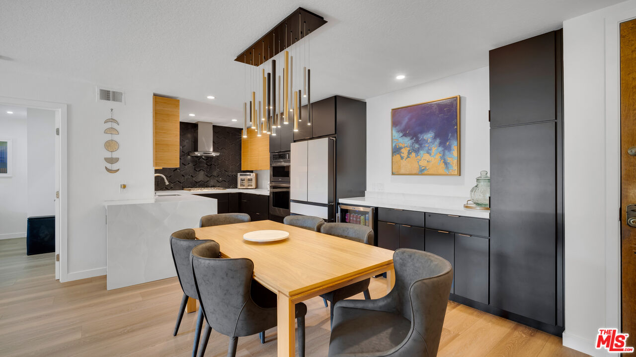 8601 Falmouth Avenue, Unit 224 Playa del Rey, CA 90293 - Photo 6 of 41 a large kitchen with a table and chairs