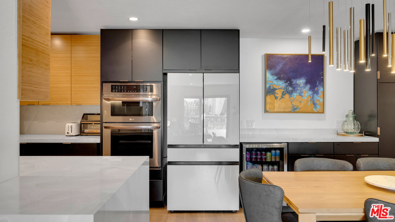 8601 Falmouth Avenue, Unit 224 Playa del Rey, CA 90293 - Photo 10 of 41 a kitchen with stainless steel appliances a refrigerator and a stove top oven