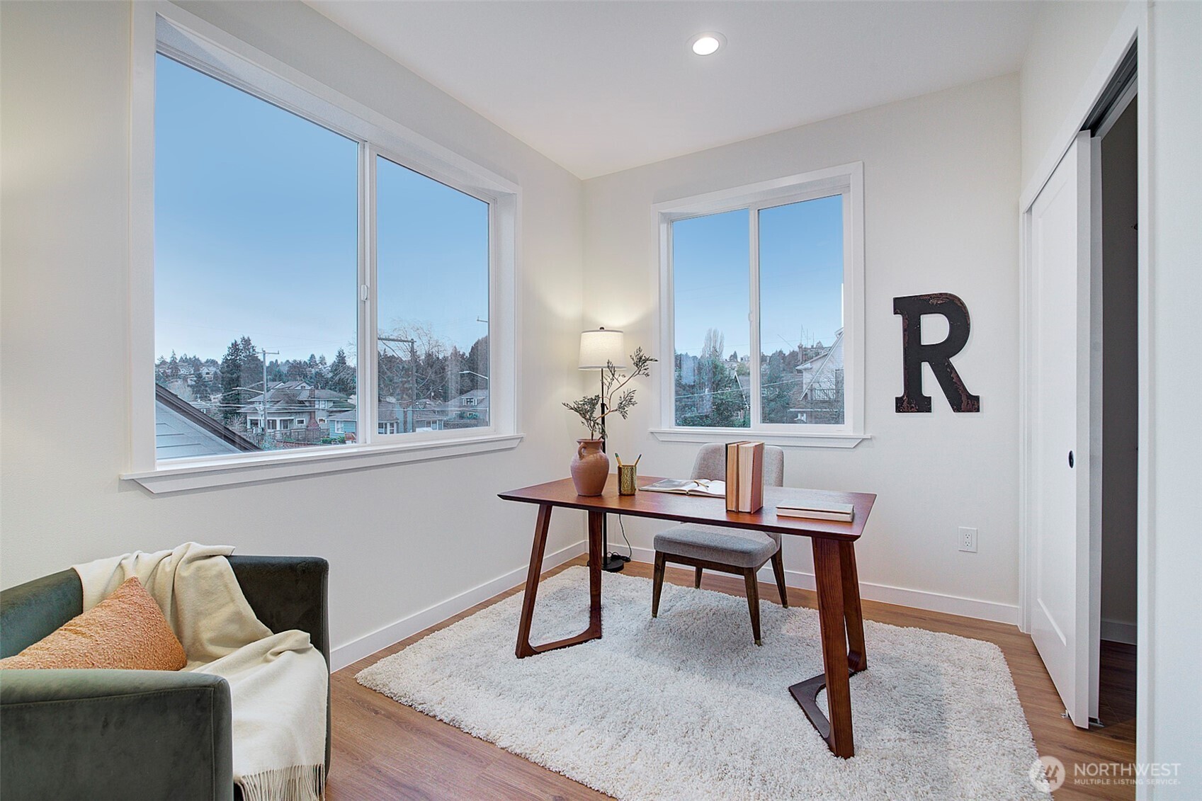 7008 Linden Avenue North Seattle, WA 98103 - Photo 19 of 39 a view of a workspace with furniture and a window