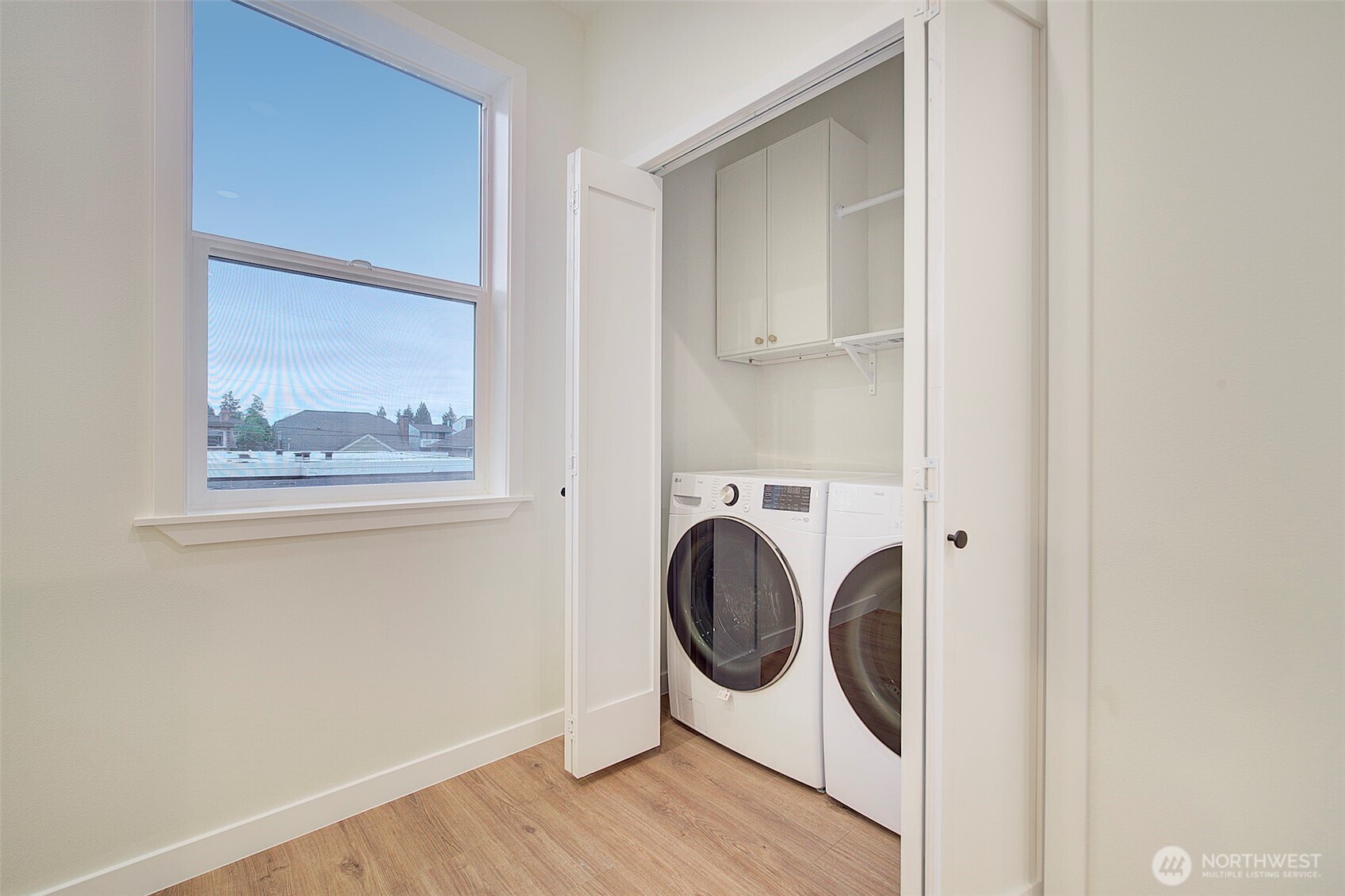 7008 Linden Avenue North Seattle, WA 98103 - Photo 22 of 39 a utility room with dryer and washer