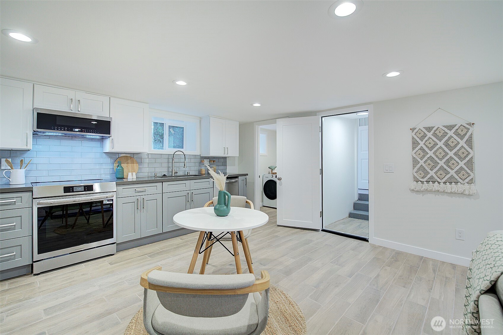7008 Linden Avenue North Seattle, WA 98103 - Photo 27 of 39 a kitchen with a refrigerator and a stove top oven