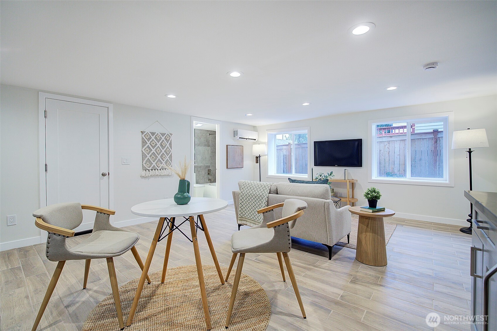 7008 Linden Avenue North Seattle, WA 98103 - Photo 29 of 39 a workspace with furniture and wooden floor