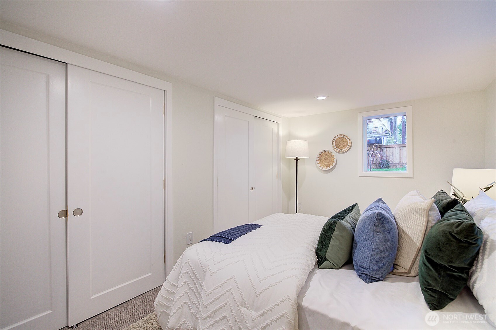 7008 Linden Avenue North Seattle, WA 98103 - Photo 31 of 39 a bedroom with a bed and a closet