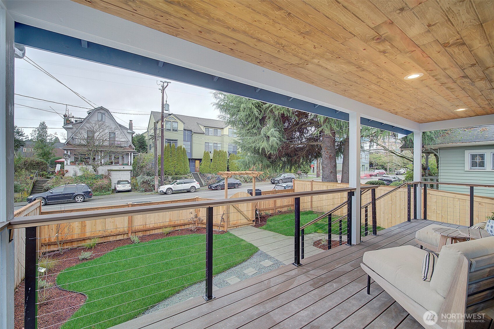 7008 Linden Avenue North Seattle, WA 98103 - Photo 36 of 39 a view of a porch with furniture and wooden floor