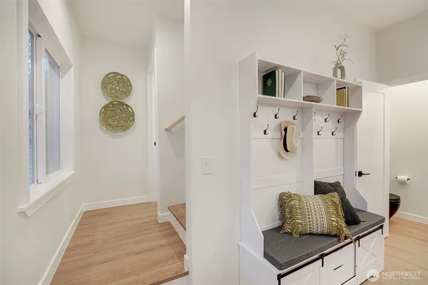 a living room with furniture and painting on the wall