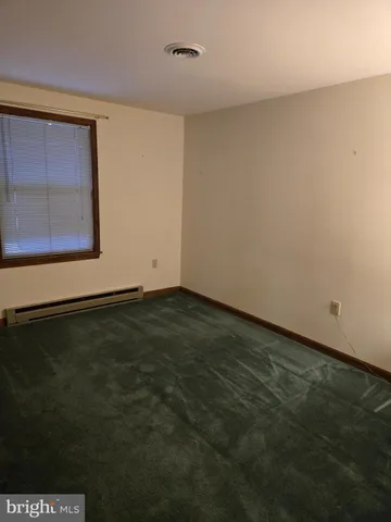 a view of a room with an empty space