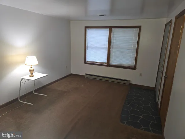 a view of livingroom and hardwood floor
