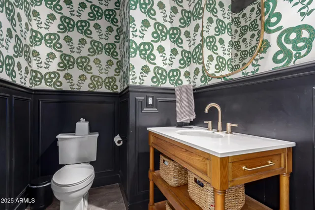 a bathroom with a toilet and a sink