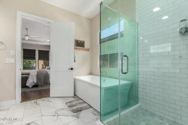 a bathroom with a tub and shower