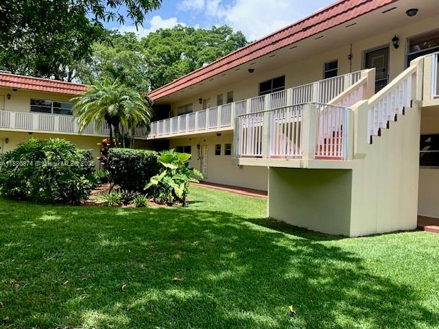 14901 Southwest 4th Street, Unit 9A Pembroke Pines, FL 33027 - Photo 4 of 6 a front view of a house with a yard