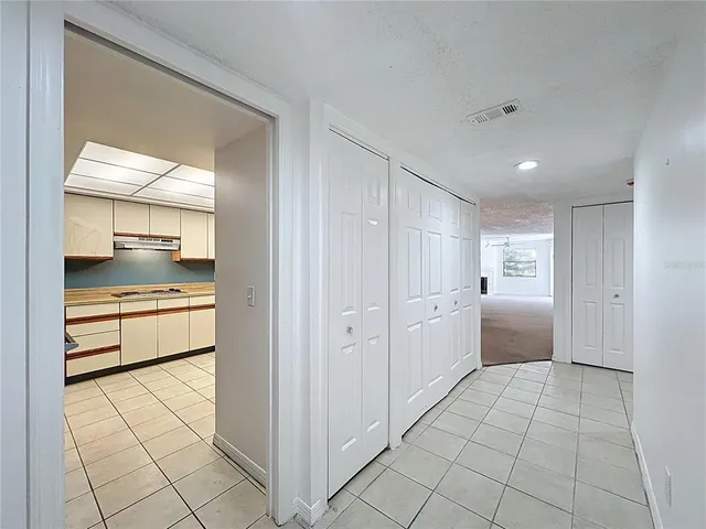 a view of a dining room with furniture and window