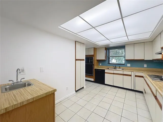 a balcony with furniture and a potted plant
