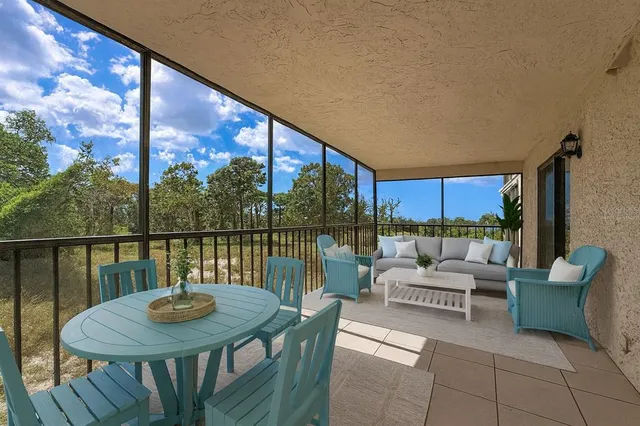 a living room with lots of furniture and a chandelier