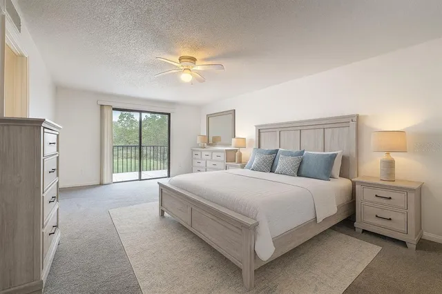 a room with gym equipment and a view of living room