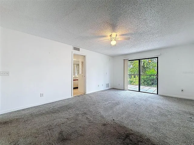 a view of a balcony with an outdoor space and seating area