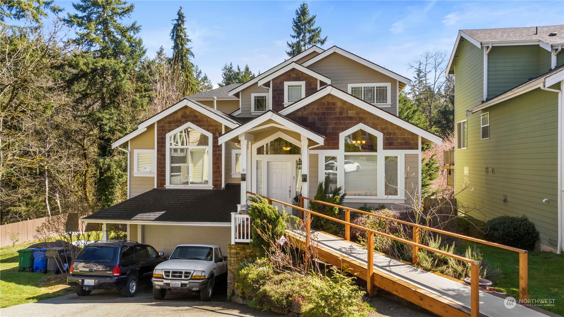 1768 Monroe Avenue Northeast Renton, WA 98056 - Photo 1 of 37 a front view of a house with a yard and garage