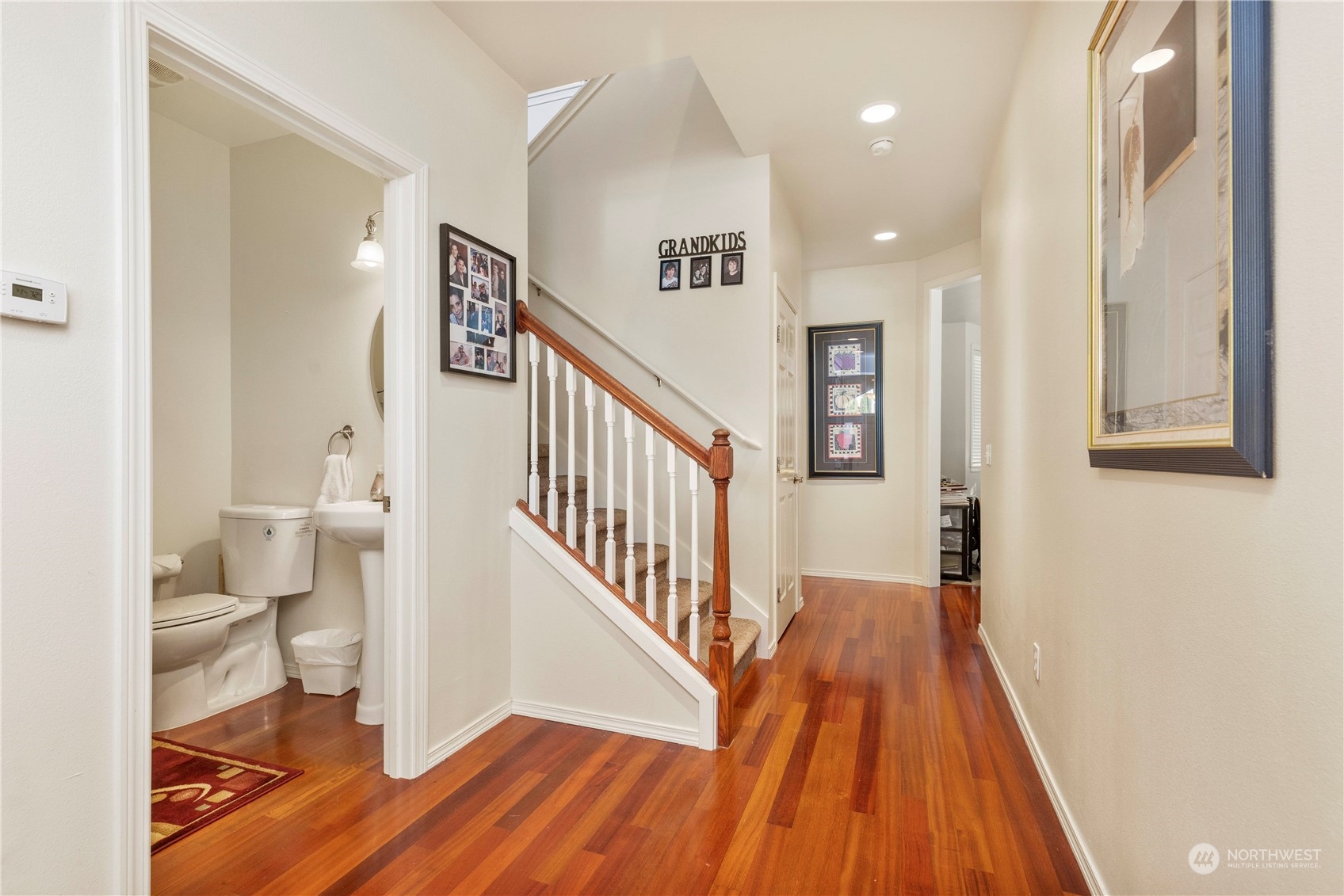 1768 Monroe Avenue Northeast Renton, WA 98056 - Photo 17 of 37 a view of a hallway with wooden floor and staircase