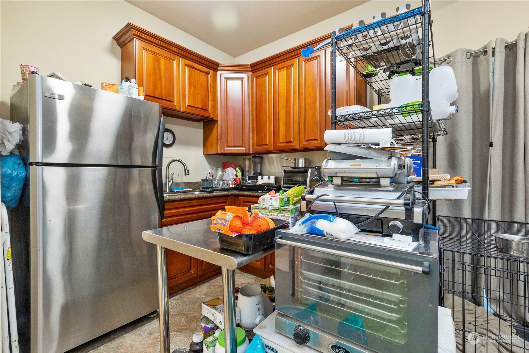 1768 Monroe Avenue Northeast Renton, WA 98056 - Photo 28 of 37 a kitchen with stainless steel appliances a refrigerator and a stove