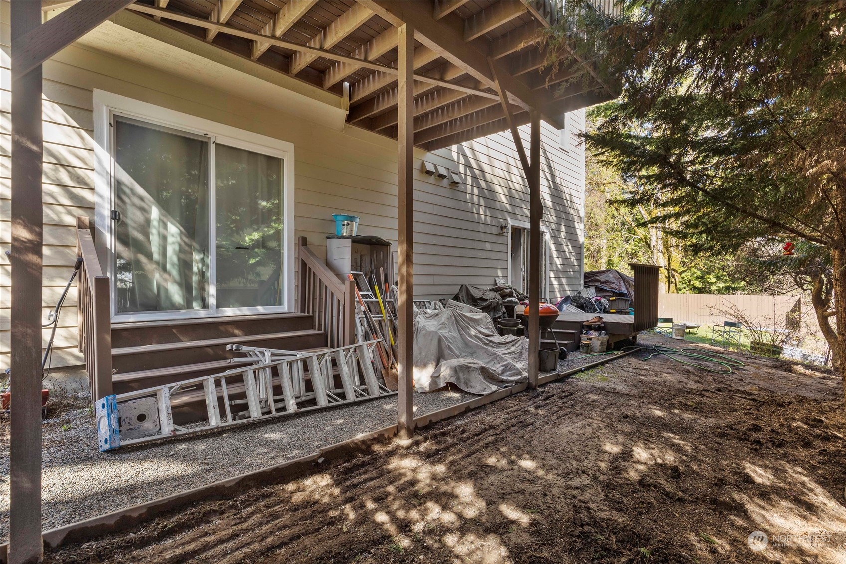 1768 Monroe Avenue Northeast Renton, WA 98056 - Photo 34 of 37 a view of a chairs setting in backyard of the house