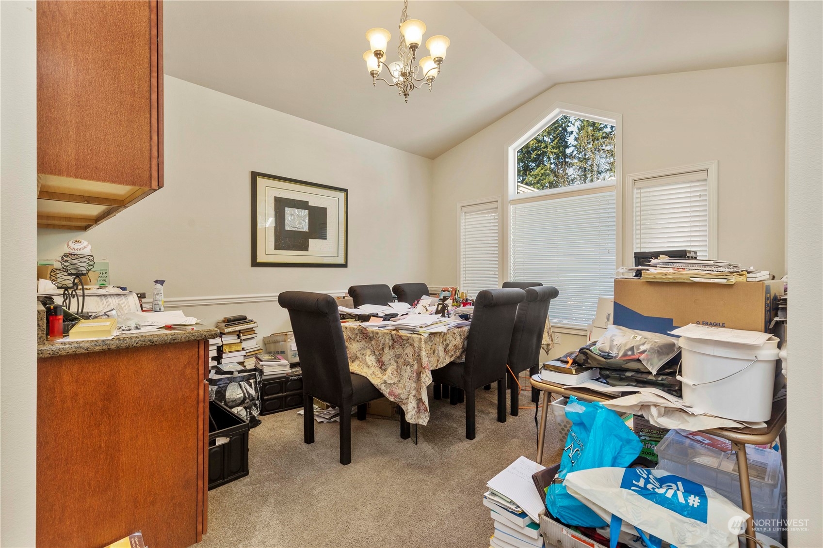 1768 Monroe Avenue Northeast Renton, WA 98056 - Photo 9 of 37 a view of a dining room with furniture and a chandelier