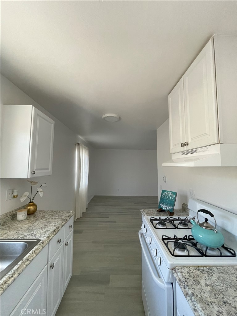 1781 West Ball Road Anaheim, CA 92804 - Photo 31 of 33 Unit #4 Kitchen looking into dining room and living room