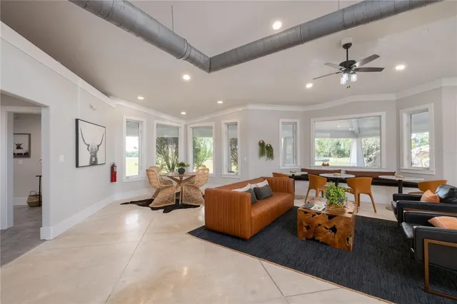 a view of a house with a yard and tree