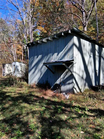 a view of house with wooden fence