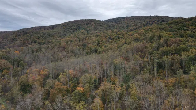 a view of a mountain range in a cloudy sky