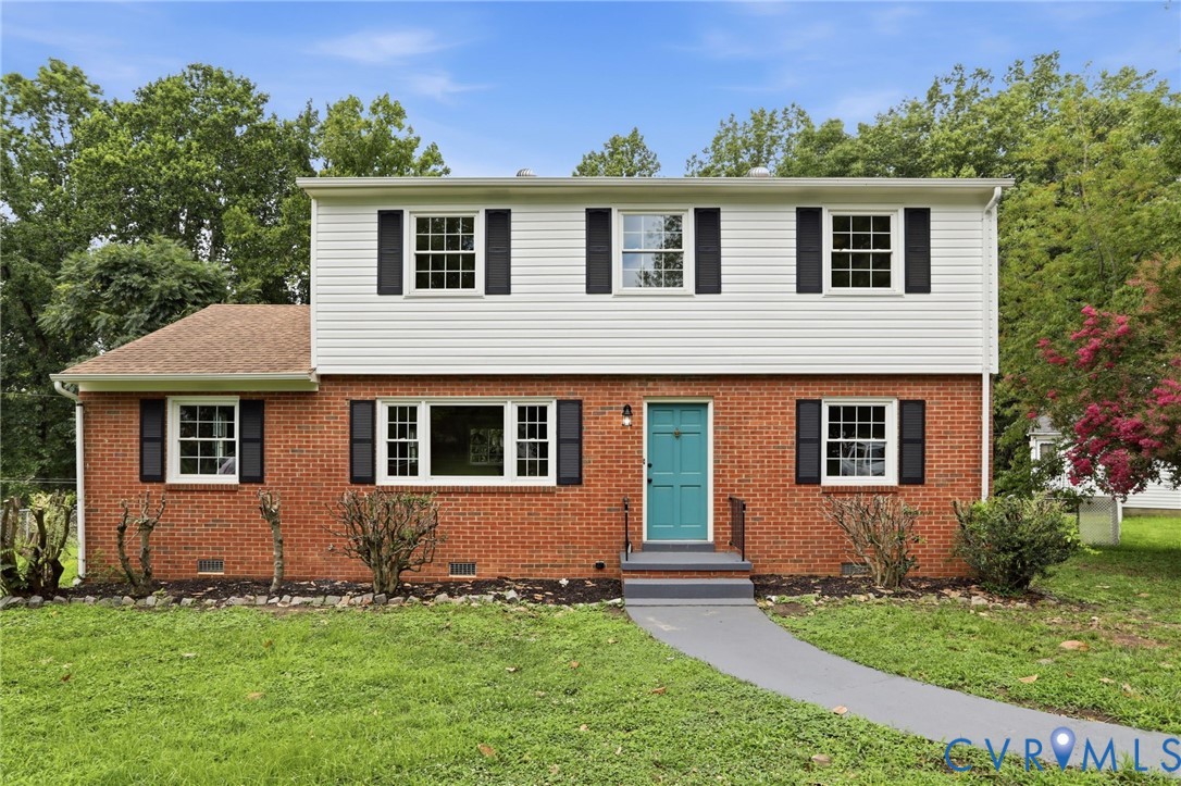5301 Dalglish Road Richmond, VA 23223 - Photo 1 of 42 Brick and siding exterior featuring a vibrant teal