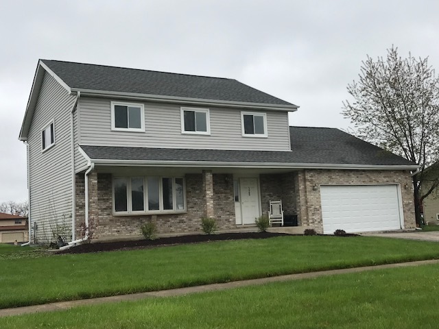 125 Red Barn Road Matteson, IL 60443 - Photo 1 of 14 a front view of a house with a yard and garage