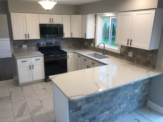 125 Red Barn Road Matteson, IL 60443 - Photo 2 of 14 a kitchen with stainless steel appliances a sink a stove a microwave a sink a refrigerator and cabinets