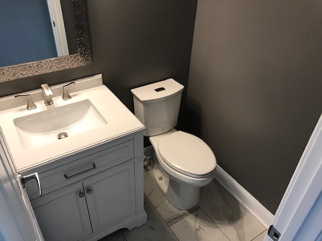 125 Red Barn Road Matteson, IL 60443 - Photo 13 of 14 a white toilet sitting next to a bathroom sink