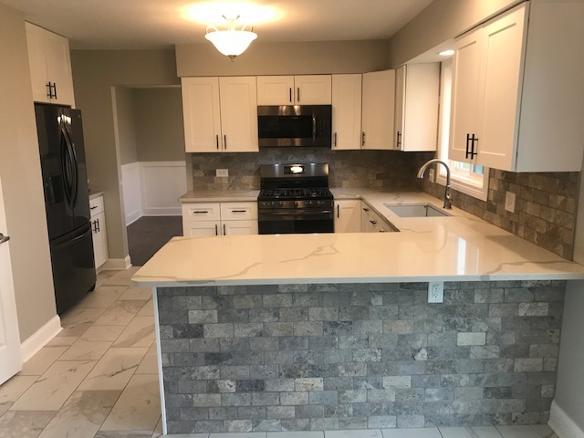 125 Red Barn Road Matteson, IL 60443 - Photo 3 of 14 a kitchen with a sink a counter top space cabinets and stainless steel appliances