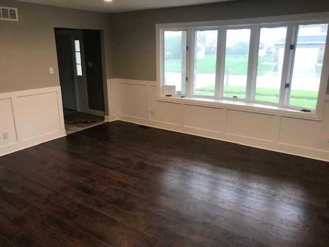 125 Red Barn Road Matteson, IL 60443 - Photo 7 of 14 an empty room with wooden floor and windows