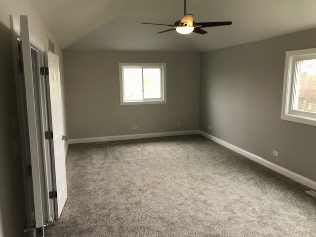 125 Red Barn Road Matteson, IL 60443 - Photo 9 of 14 an empty room with windows and fan