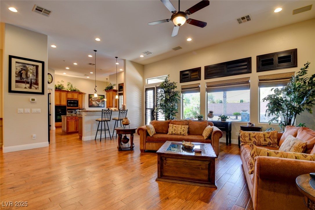 8465 West Picket Ridge Court Las Vegas, NV 89143 - Photo 11 of 51 Seamless Flow from Living Room to Kitchen with Backyard Access