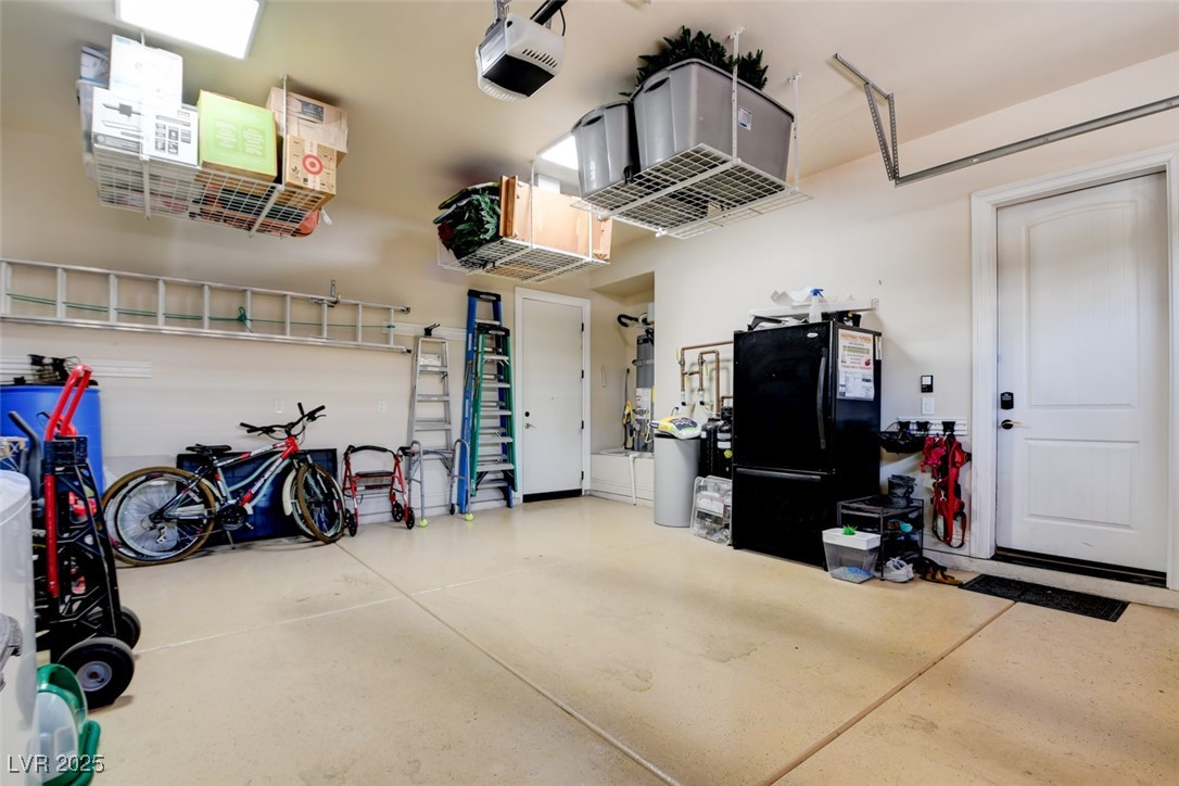 8465 West Picket Ridge Court Las Vegas, NV 89143 - Photo 40 of 51 Oversized two-car garage with overhead storage and shutters that let in natural light