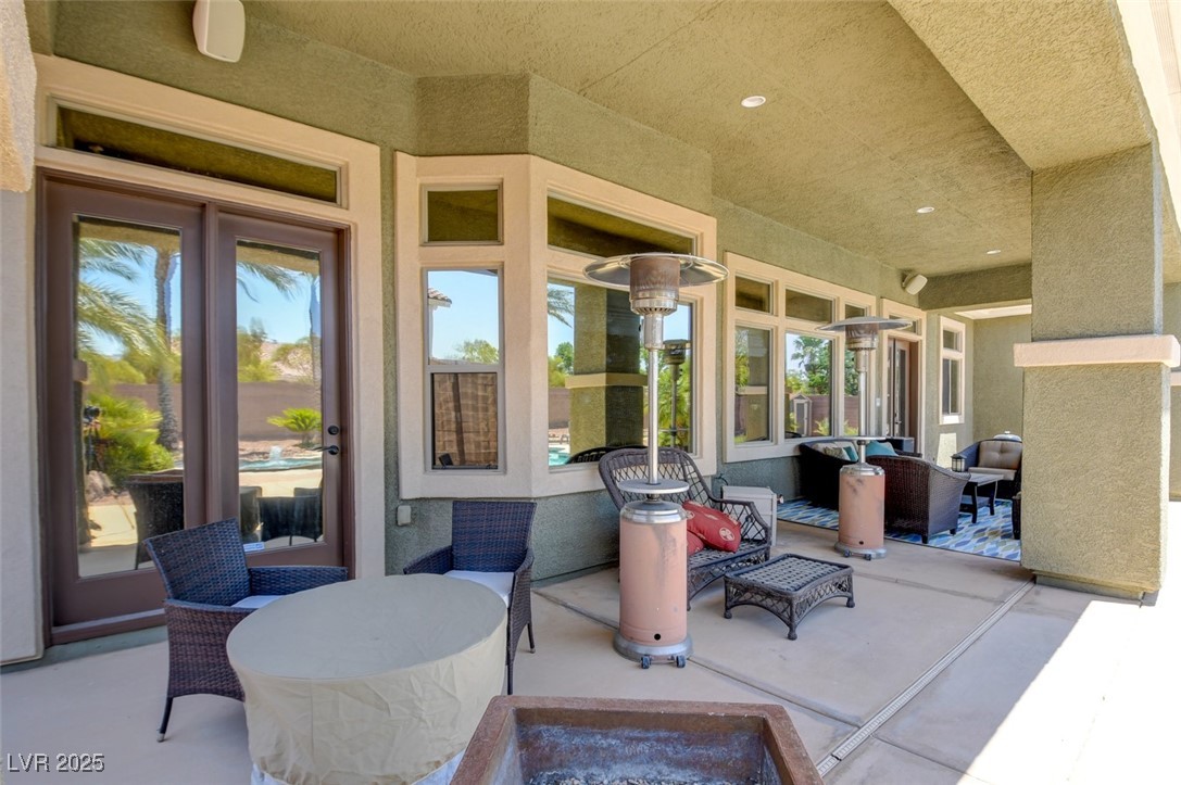8465 West Picket Ridge Court Las Vegas, NV 89143 - Photo 44 of 51 Deeply set back patio area & energy-saving tinted windows throughout the home