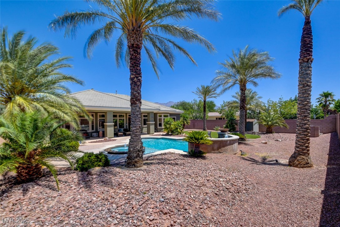 8465 West Picket Ridge Court Las Vegas, NV 89143 - Photo 46 of 51 Large backyard with mature, well-kept desert landscaping