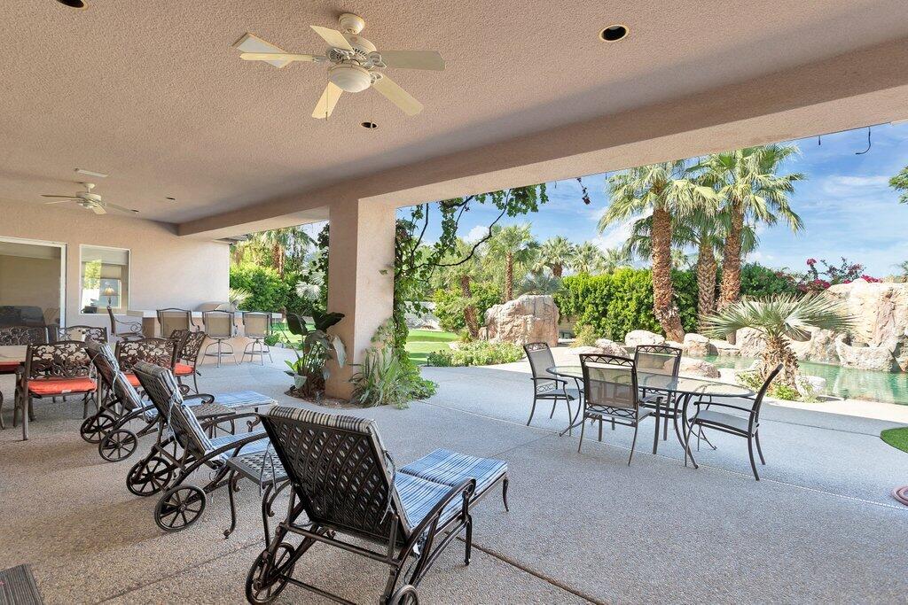8 MacBeth Court Rancho Mirage, CA 92270 - Photo 32 of 46 a view of a dining room with furniture window and outside view