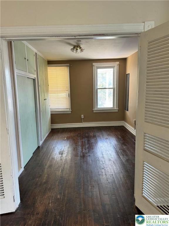 610 West Garrison Street, Unit 1 Bethlehem, PA 18018 - Photo 12 of 15 an empty room with wooden floor and windows