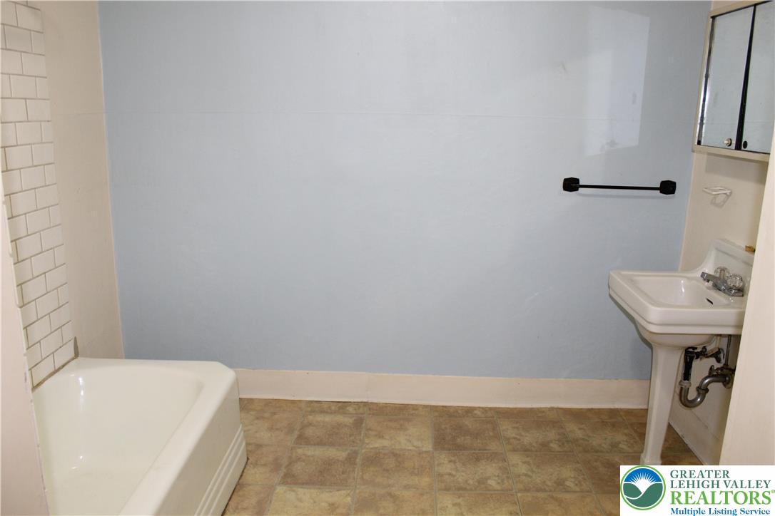 610 West Garrison Street, Unit 1 Bethlehem, PA 18018 - Photo 13 of 15 a bathroom with a sink a toilet and bathtub