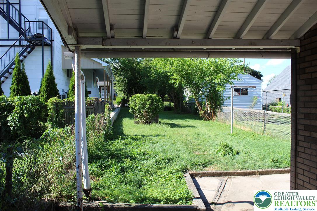 610 West Garrison Street, Unit 1 Bethlehem, PA 18018 - Photo 15 of 15 a view of a backyard door with potted plants