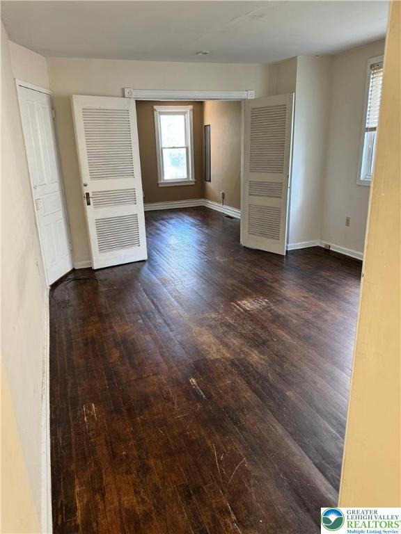 610 West Garrison Street, Unit 1 Bethlehem, PA 18018 - Photo 8 of 15 wooden floor in an empty room with a window