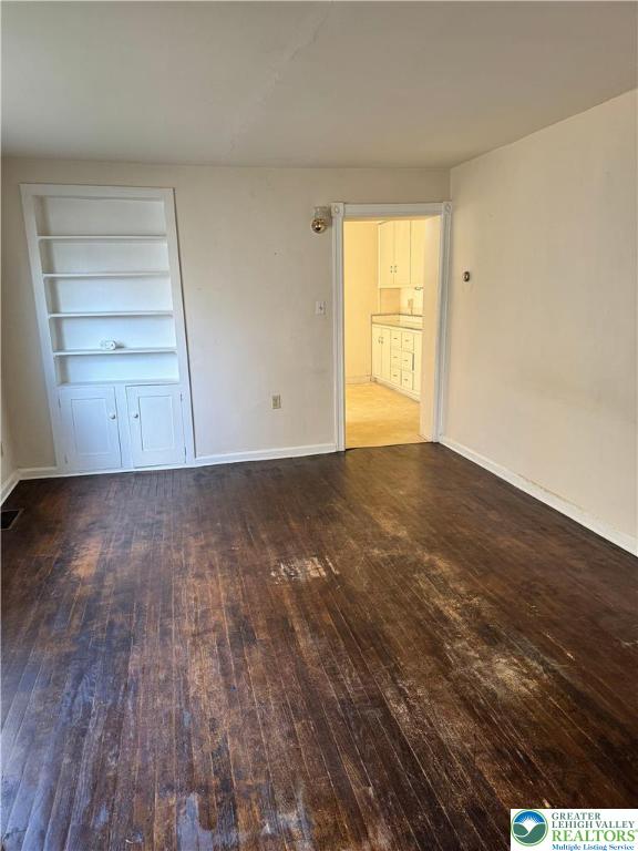 610 West Garrison Street, Unit 1 Bethlehem, PA 18018 - Photo 9 of 15 a view of an empty room with a window and wooden floor