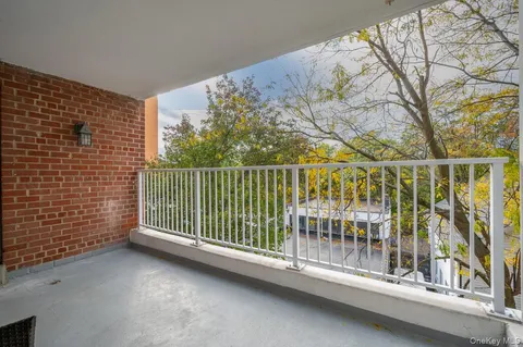 a view of a balcony with a pot