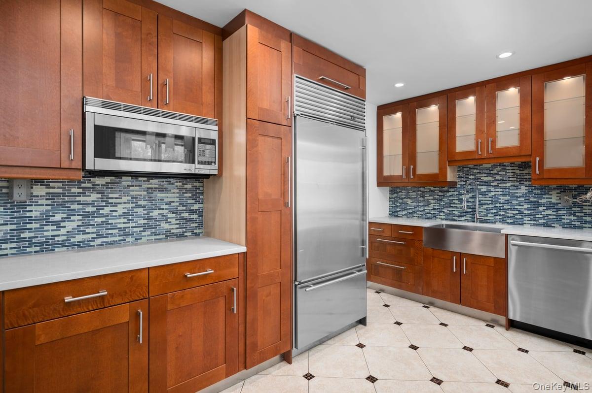 600 Locust Street, Unit 2J Mount Vernon, NY 10552 - Photo 2 of 18 a kitchen with stainless steel appliances granite countertop a refrigerator and a sink