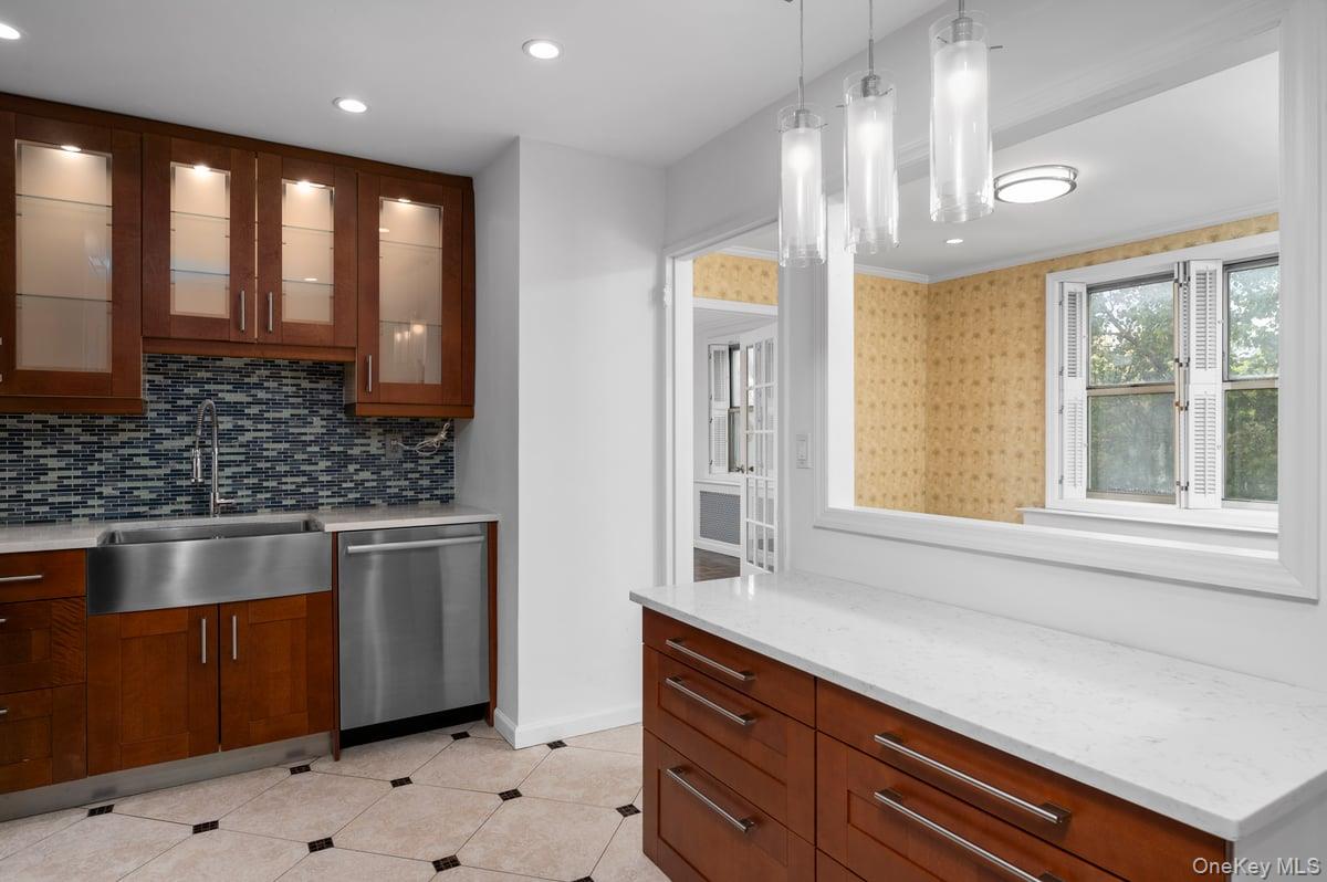 600 Locust Street, Unit 2J Mount Vernon, NY 10552 - Photo 3 of 18 a kitchen with stainless steel appliances granite countertop a sink a stove and a window