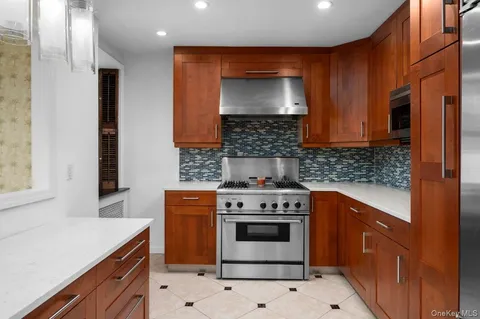 a kitchen with a stove and a sink